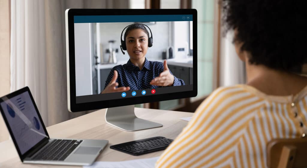 Professional interviewing candidate over video conference call