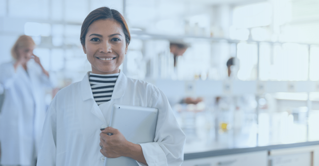 Woman scientist holding a tablet in a lab setting