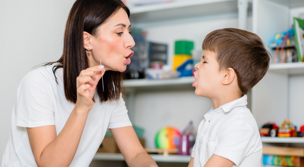 speech language pathologist in school with student