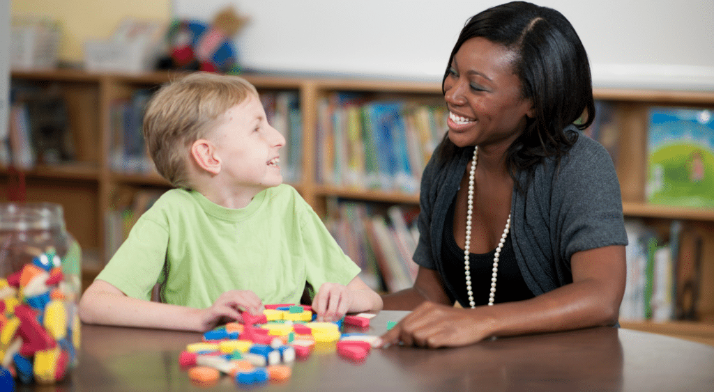 paraeducator with student